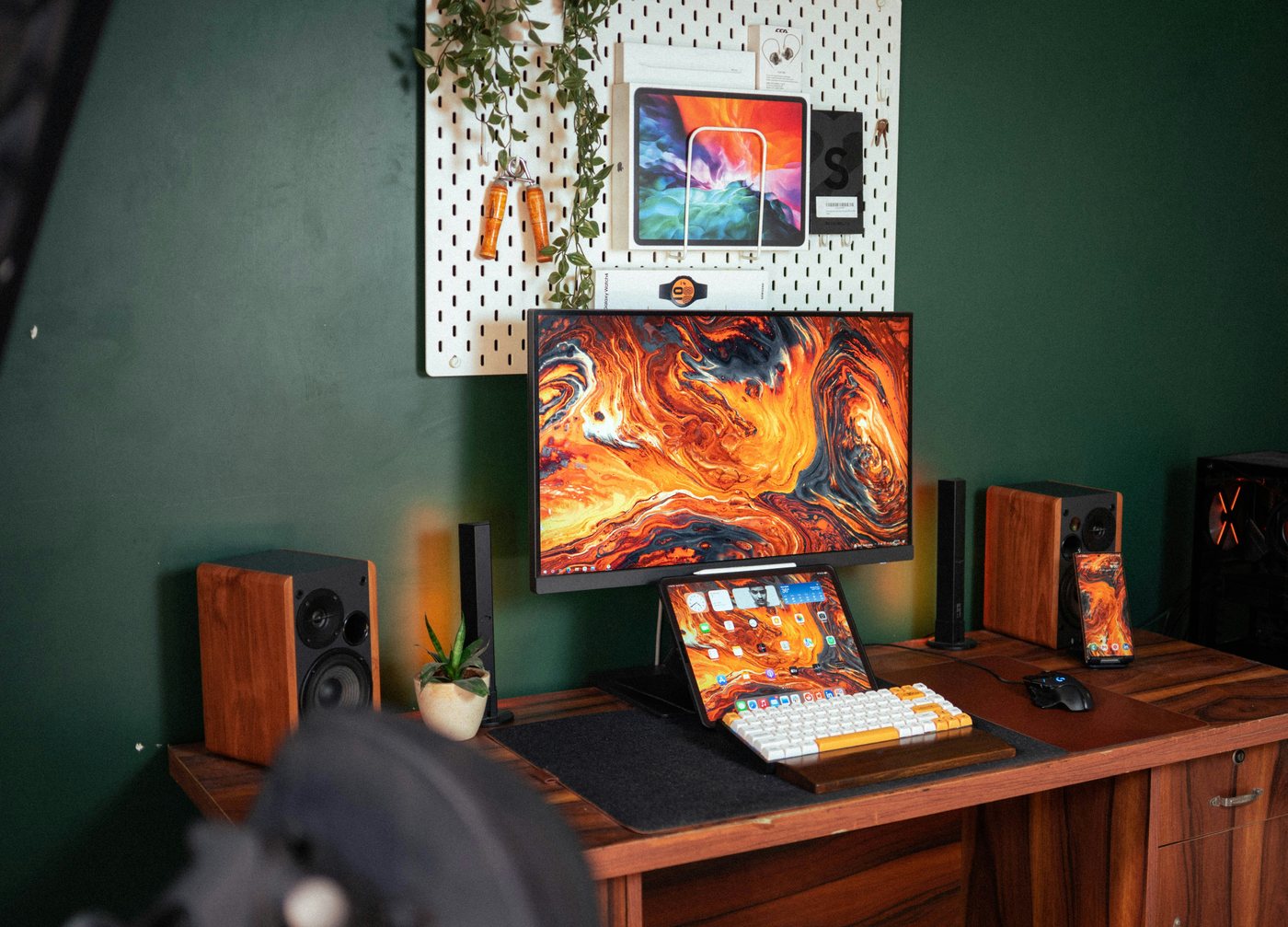 Desktop monitor on a wooden desk with warm orange lighting
